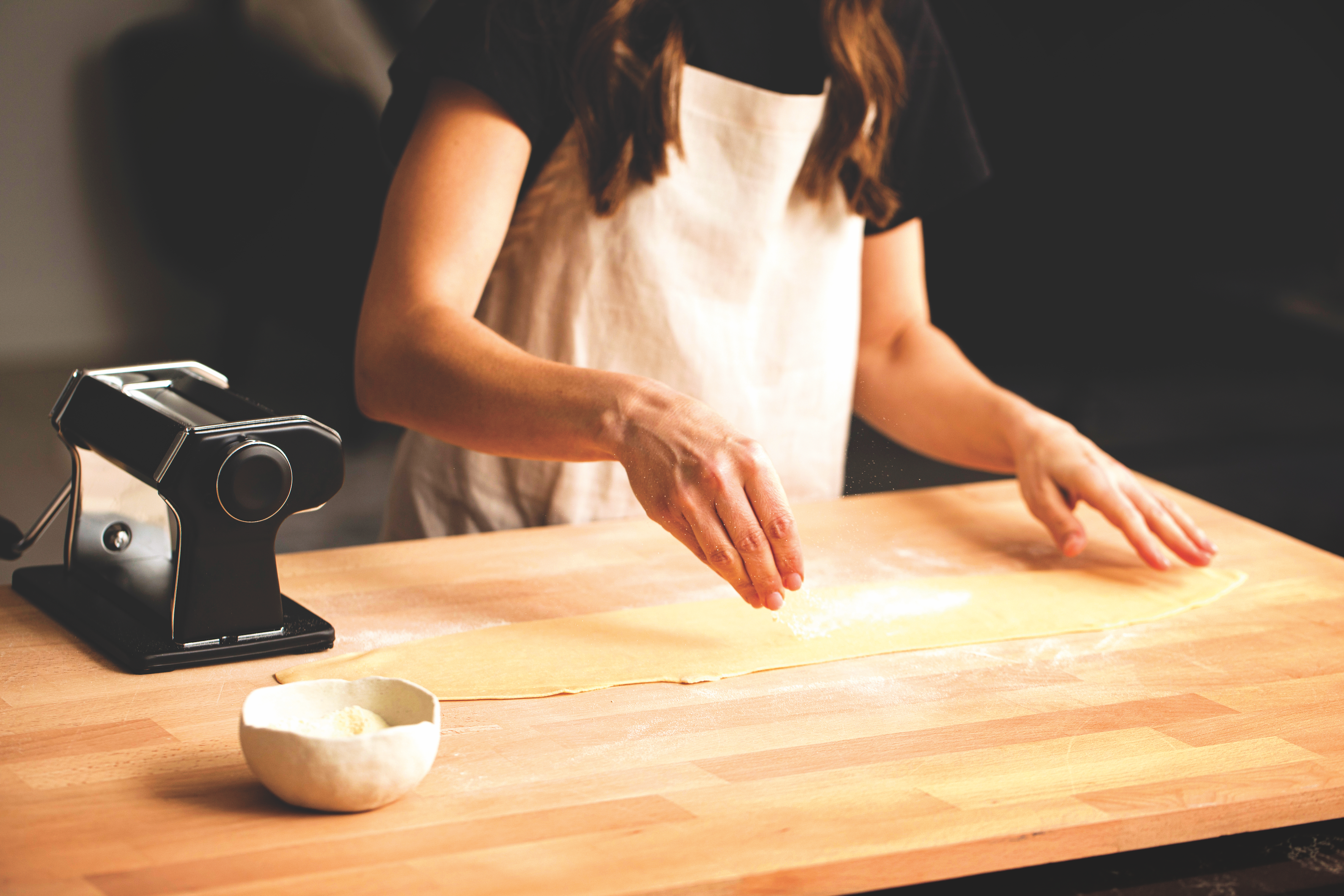 Picture of Simone dusting fresh egg pasta sheet