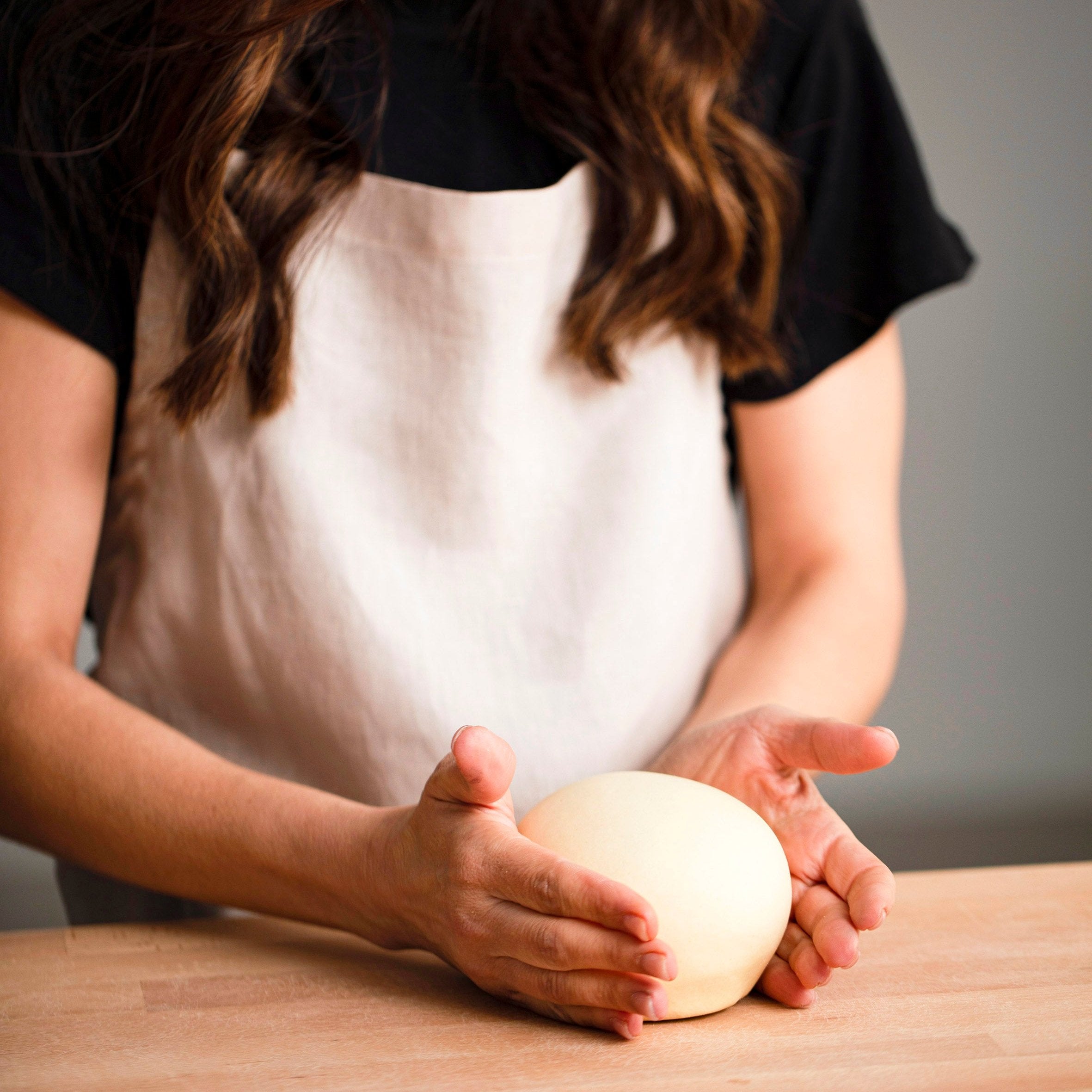Image of Simone Agostino holding a semolina pasta dough ball