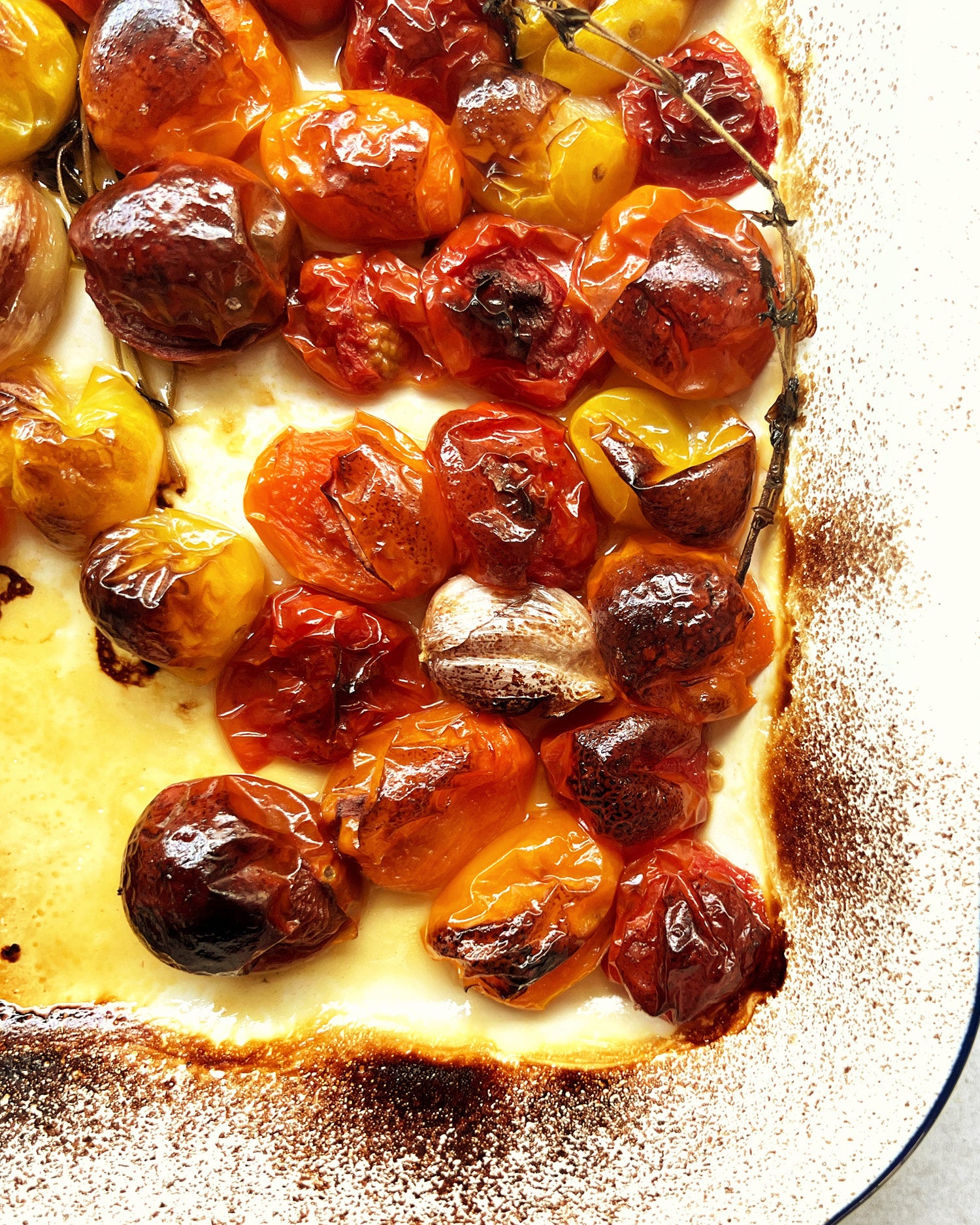 Roasted heirloom tomato in a rustic tray
