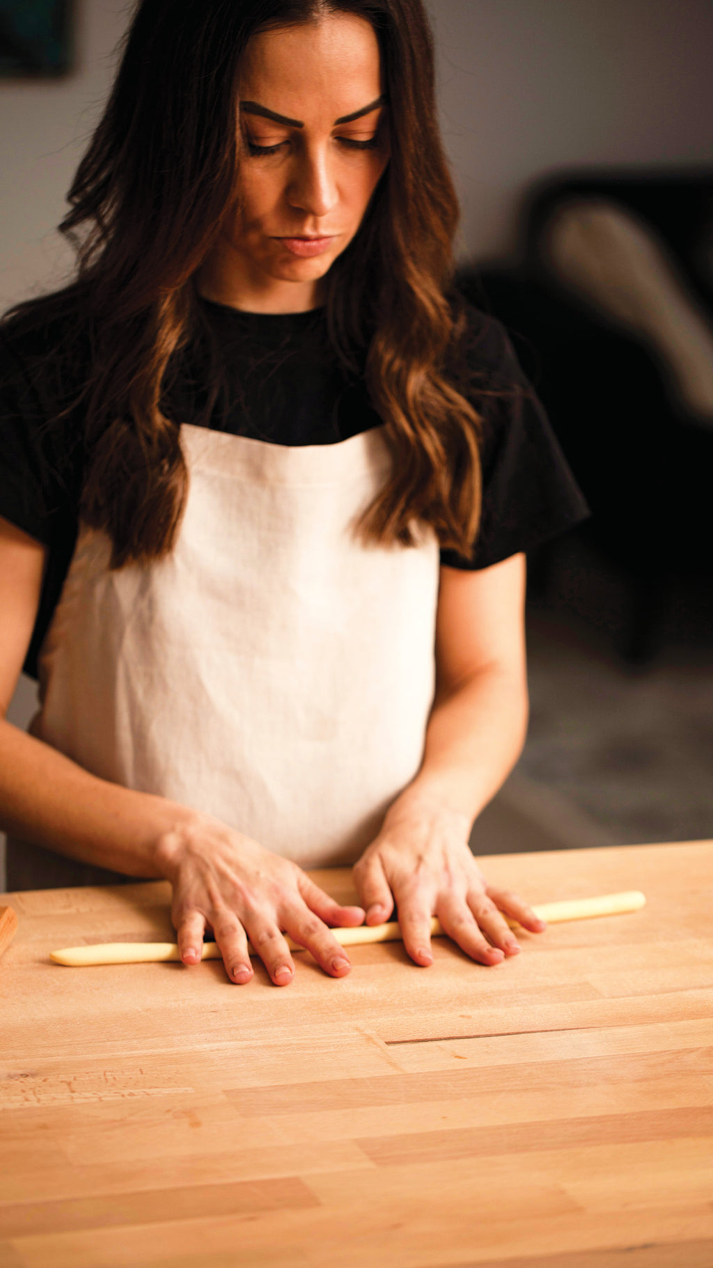 Image of Simone Agostino rolling semolina pasta ropes ready to shape cavatelli. Image from her cookbook TOO.