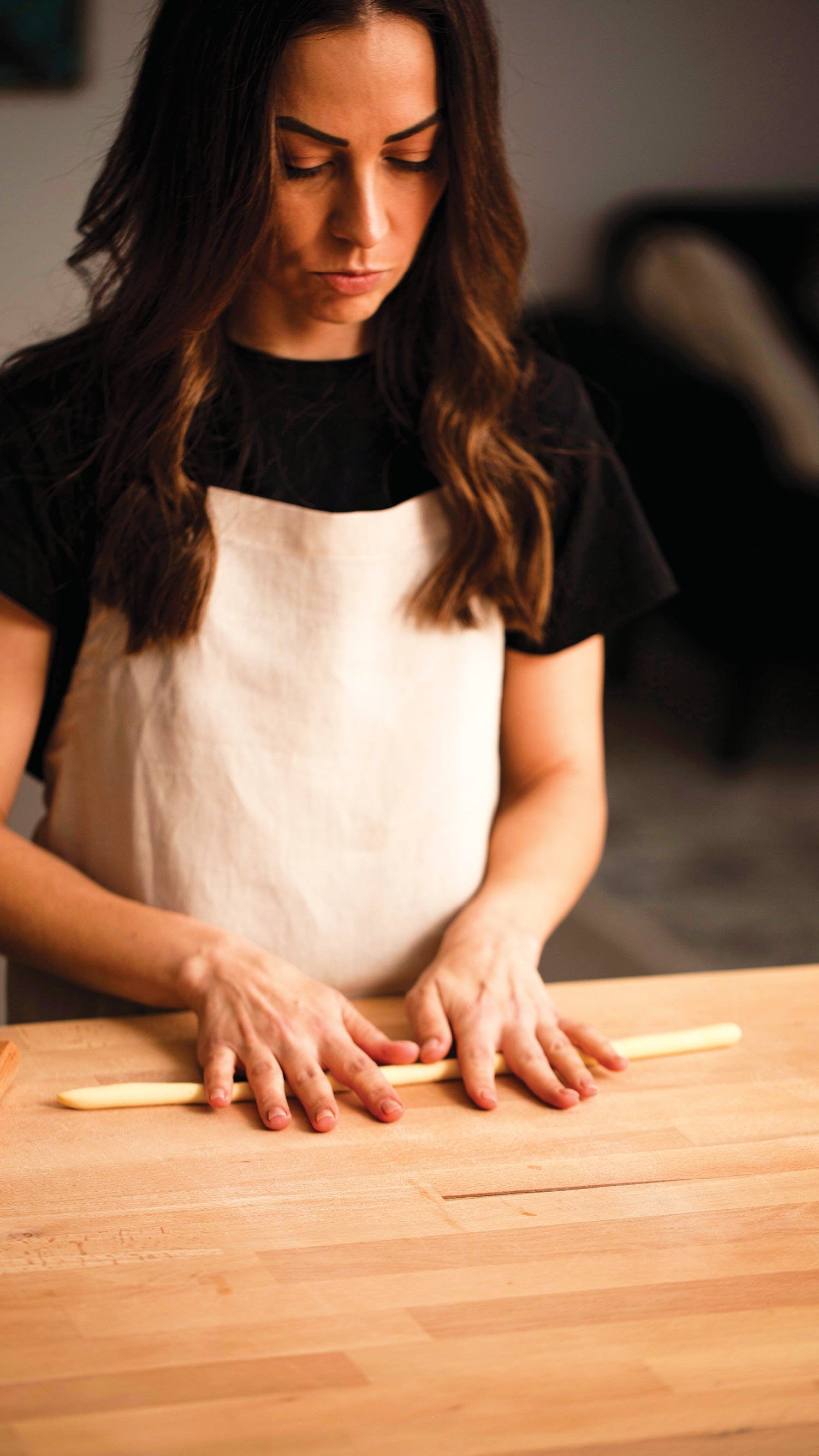 Image of Simone Agostino rolling semolina pasta ropes ready to shape cavatelli. Image from her cookbook TOO.